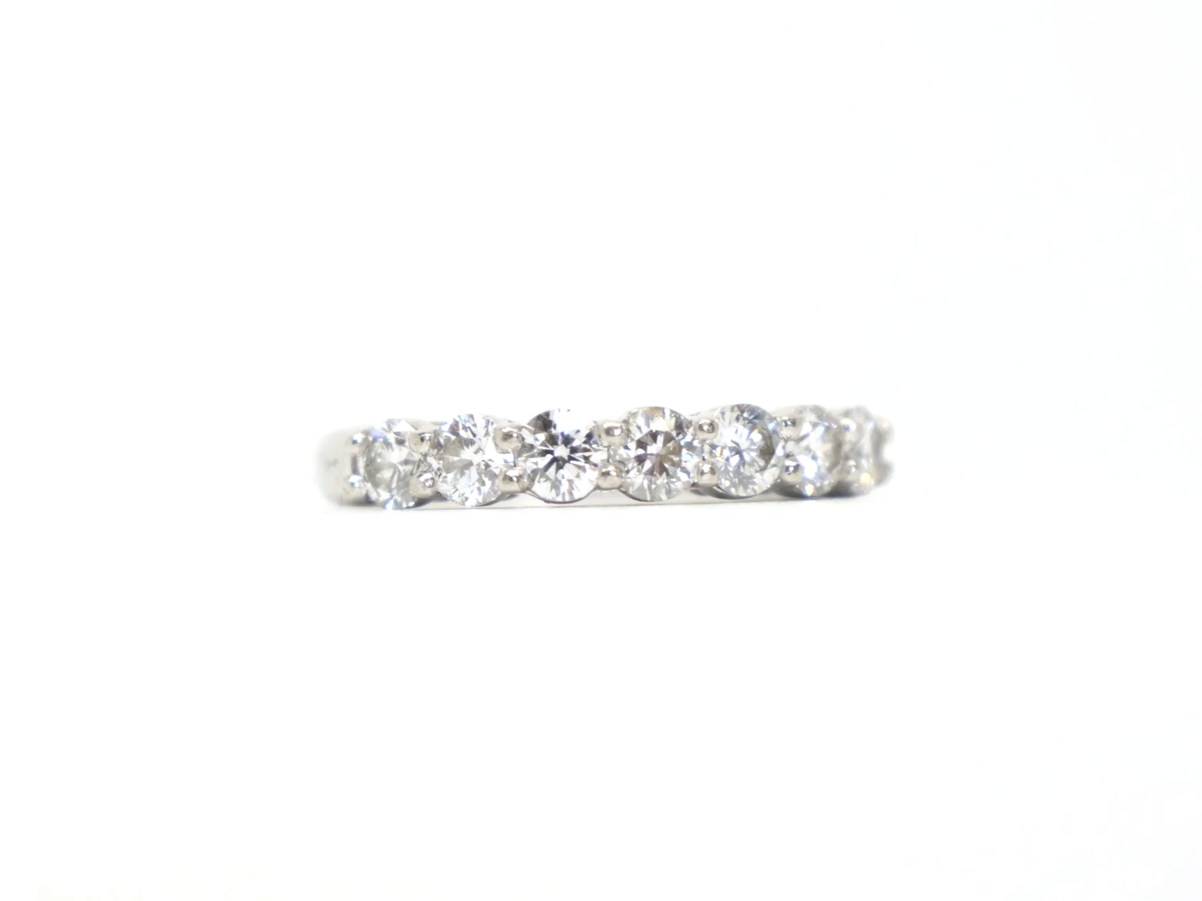 platinum diamond half-eternity ring set with seven round brilliant-cut diamonds