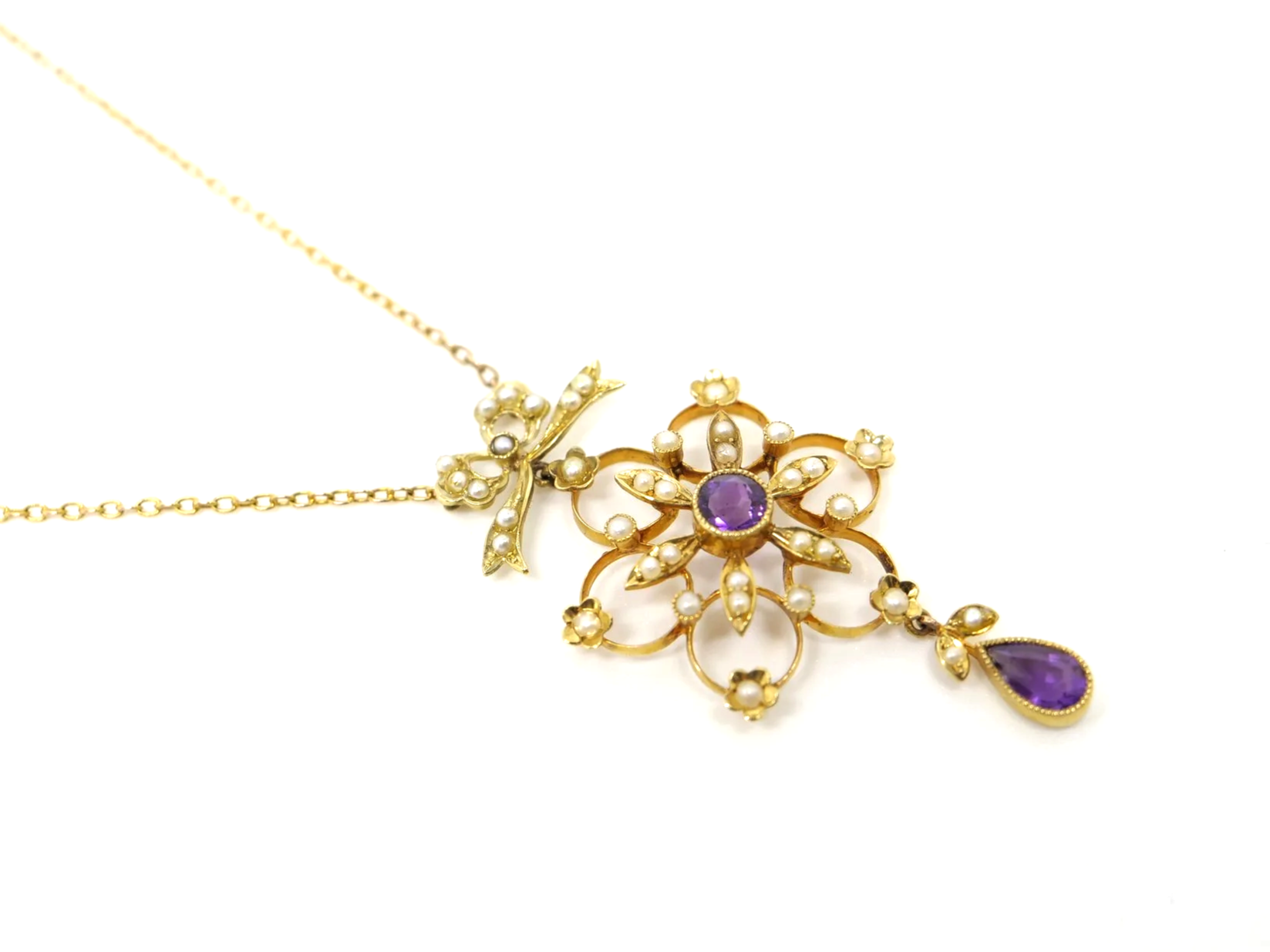 Vintage 15ct gold amethyst and seed pearl necklace, with a beautiful bow and snowflake design.