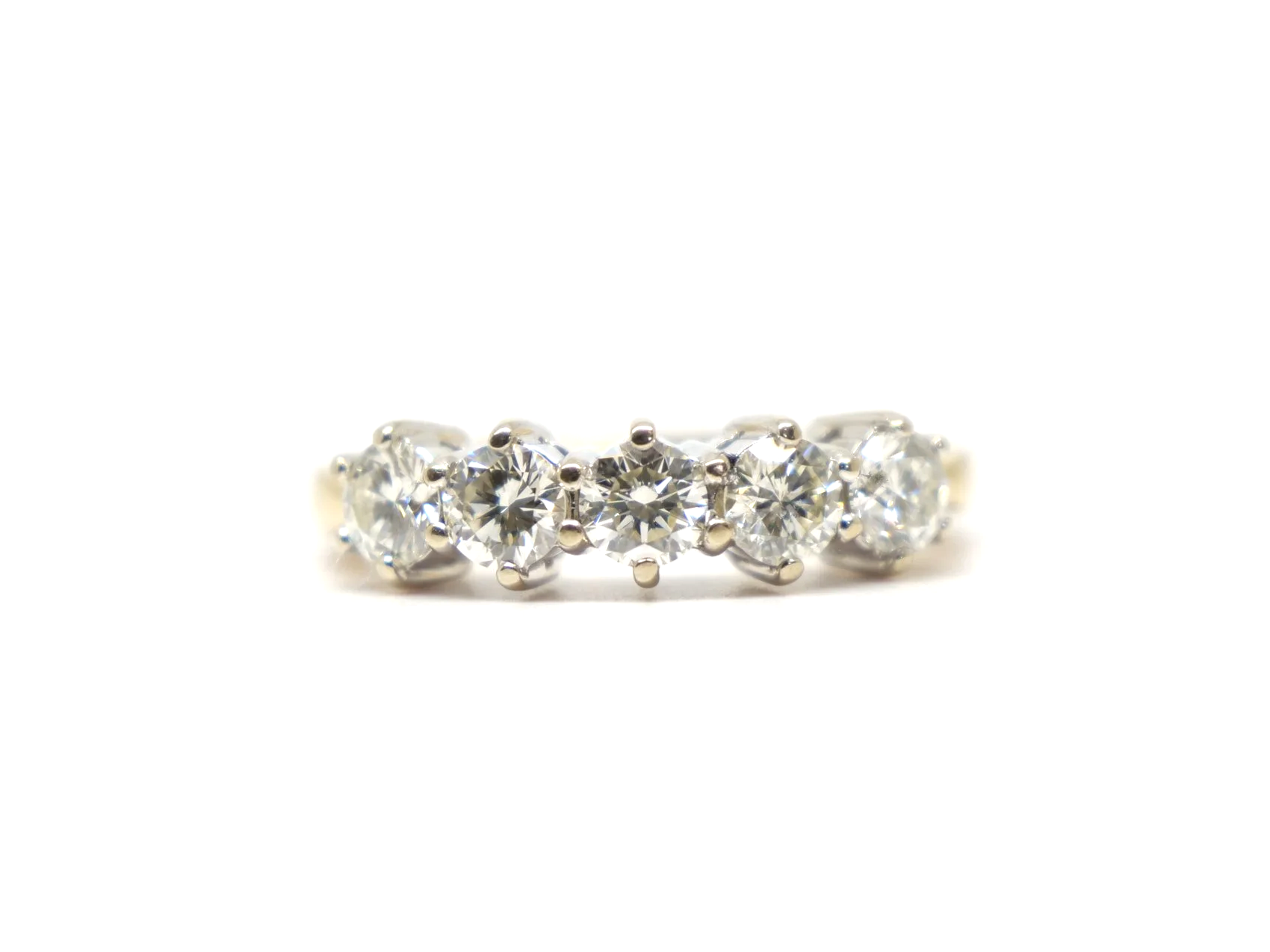 A classic five stone diamond ring in 18ct gold, set with five round brilliant cut diamonds of 1 carat in total.