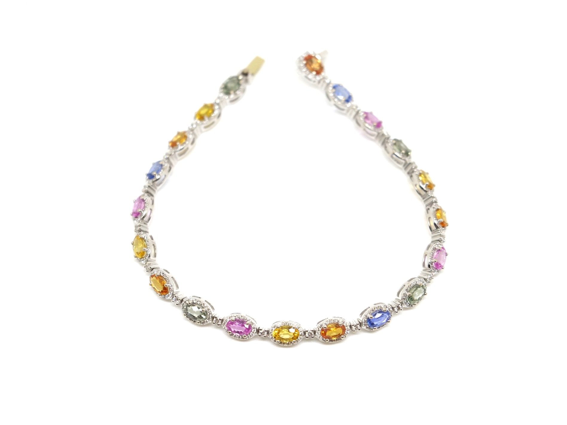 Super 18ct gold sapphire and diamond ‘rainbow’ bracelet, set with 5cts of natural multi coloured sapphires, surrounded by diamonds.