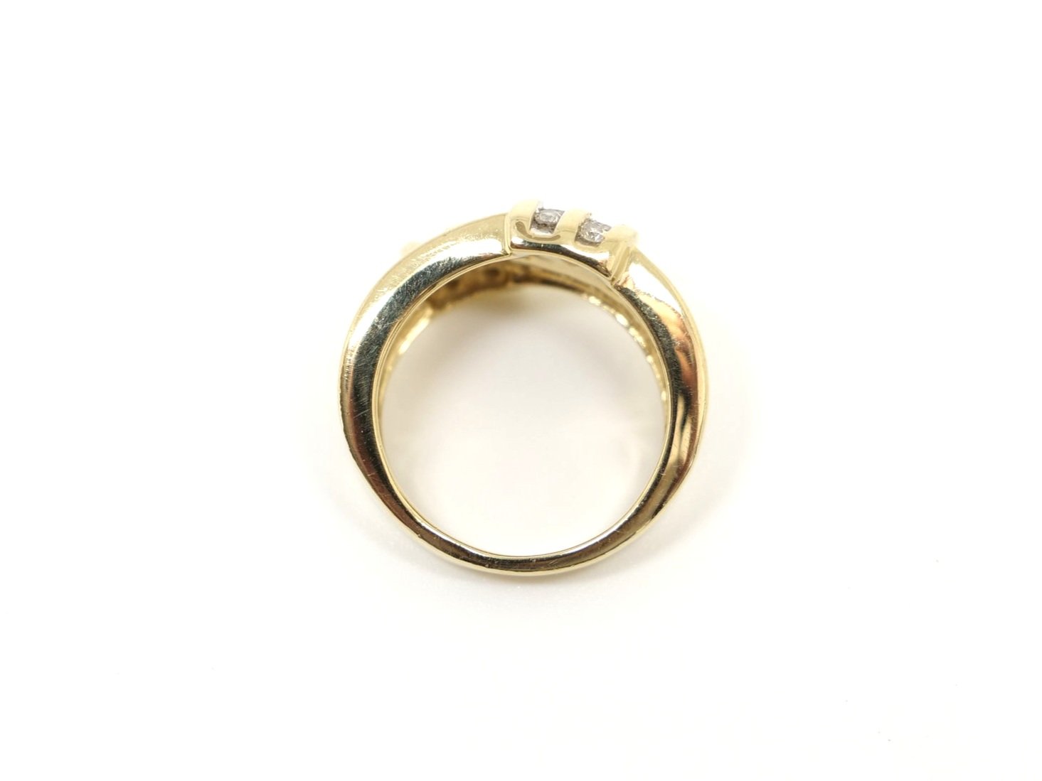Lovely 14ct gold diamond statement ring, set with forty brilliant cut diamonds in this very unusual cross over design. Approximately 1.2ct diamonds total.