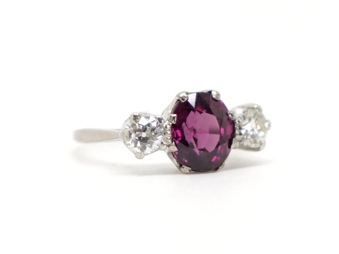 Gorgeous vintage 18ct gold & platinum pink tourmaline and diamond trilogy ring, set with a lovely oval cut pink tourmaline and set with a diamond to each side.