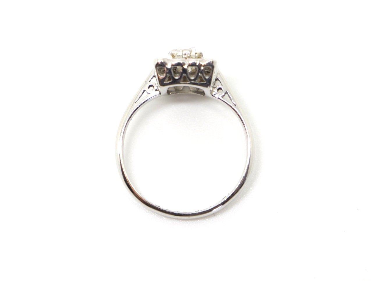Lovely vintage 18ct gold diamond ring, set with a centre baguette cut diamond of approximately 0.5cts, with further diamond surround in this unusual rectangular design.
