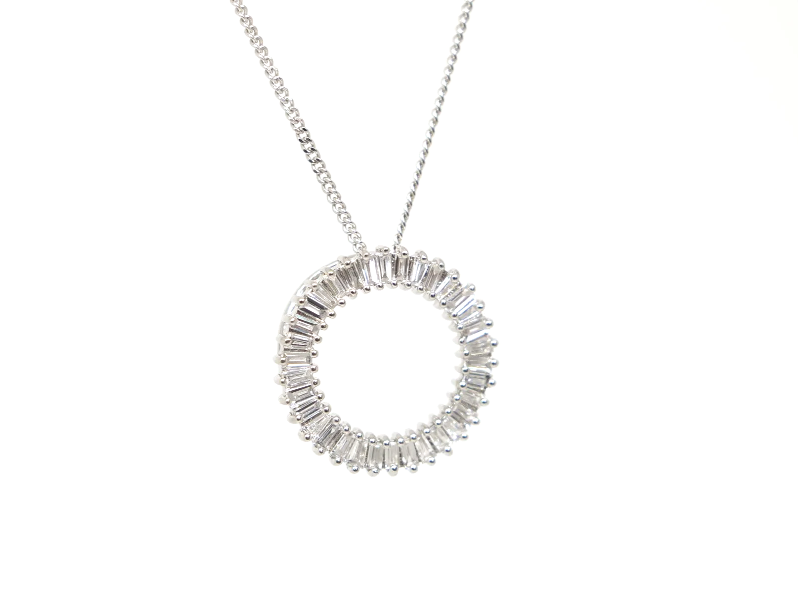 beautiful platinum diamond circle pendant set with baguette cut diamonds