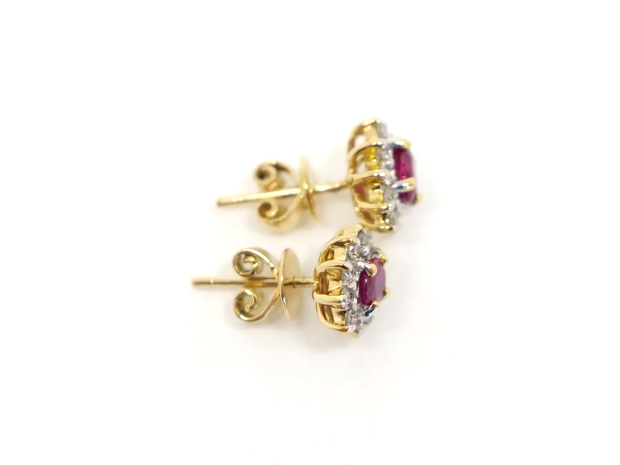 A classic pair of 18ct gold ruby and diamond earrings.