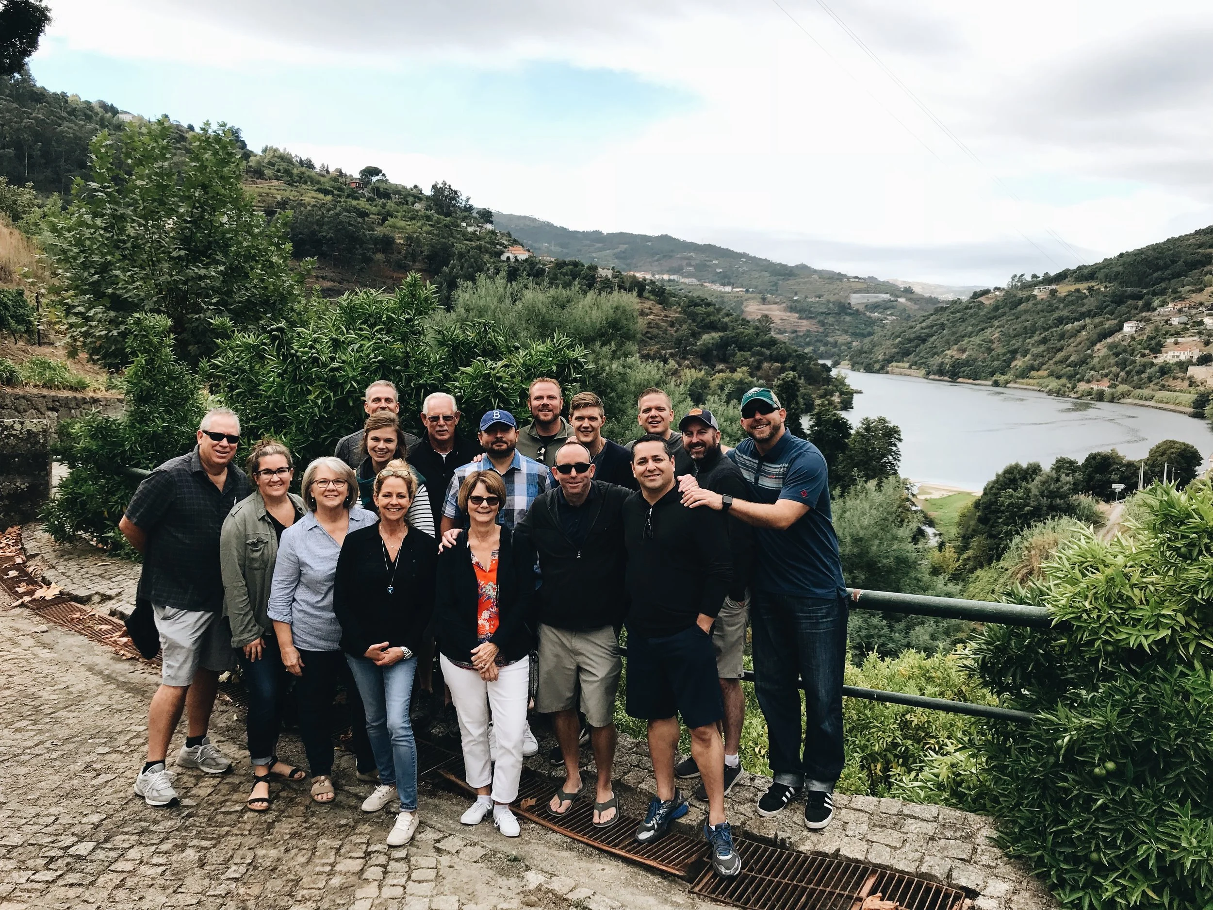 October Fall Trip 2018 attendees pose in front of the Douro river outside Quinta da Ermida in northern Portugal.