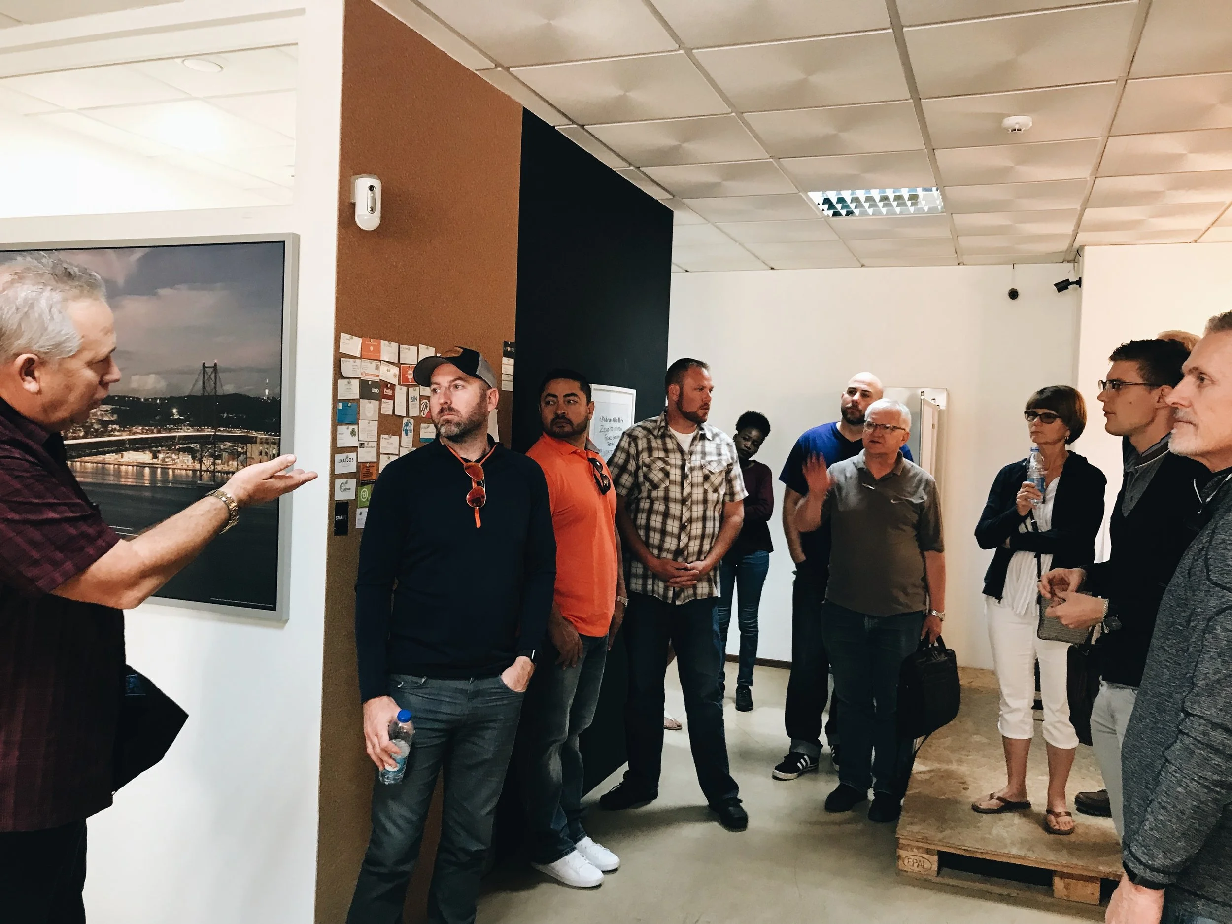 Trip attendees hear from Randy during visit to A Ponte.