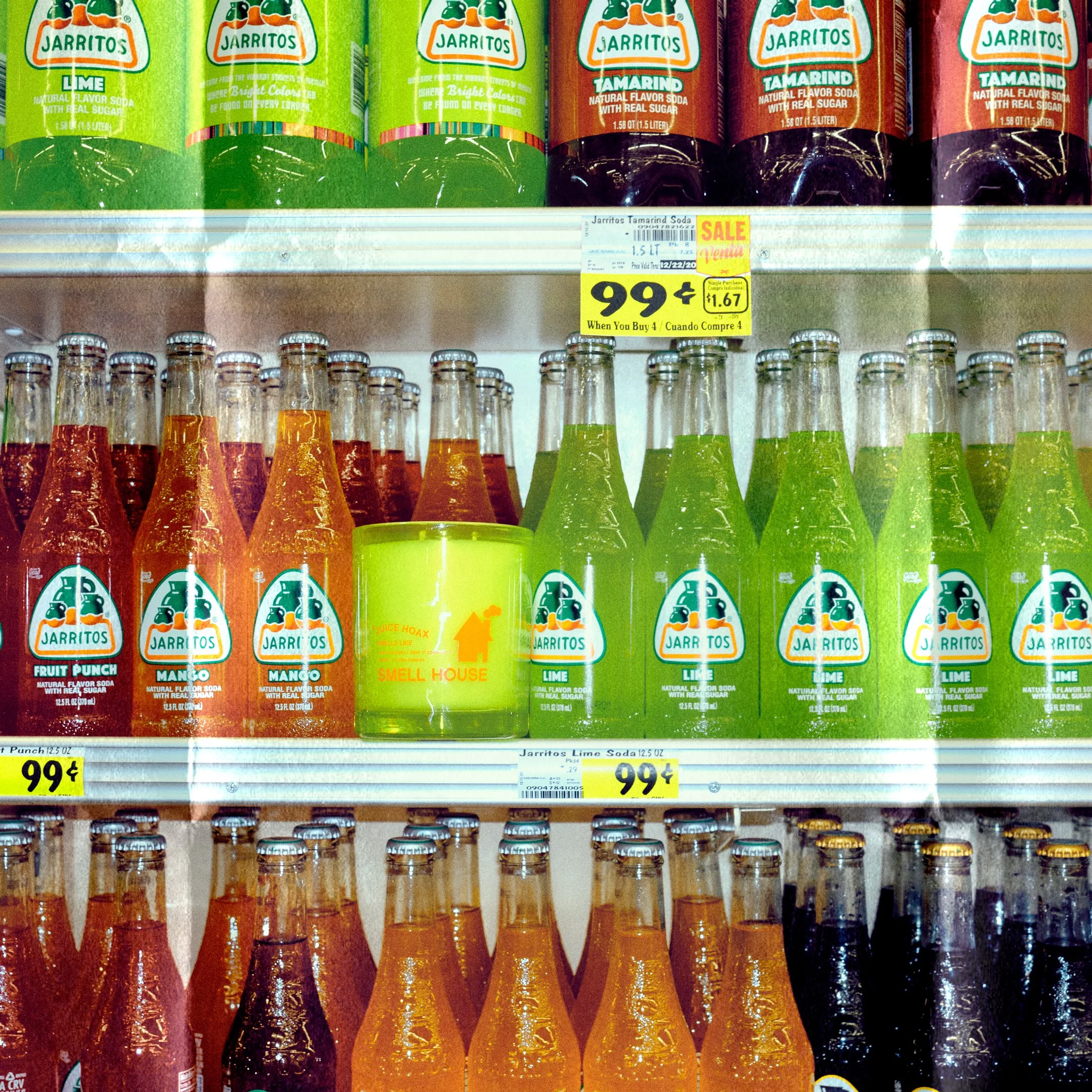 Smell House Candle in Supermarket among Jarritos