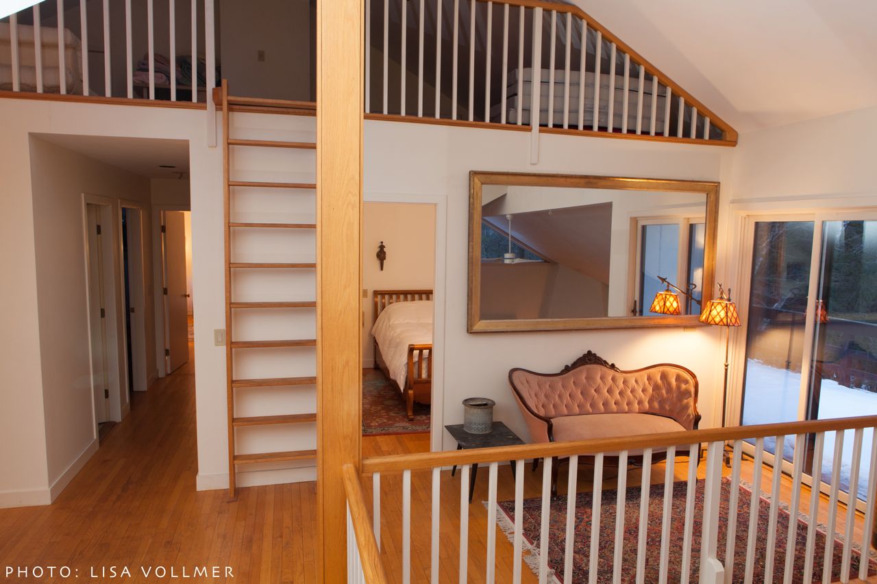 Ladder to loft and hallway at Race Mountain House