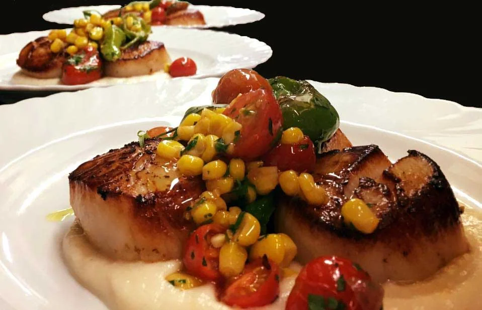 Seared New Bedford scallops with sunchoke puree, sweet corn, cherry tomatoes and blistered shishito peppers