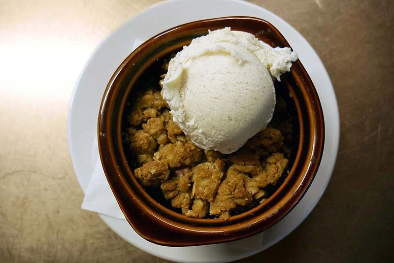 Maple sweetened apple and pear crumble with your choice of Soco vanilla bean or salted caramel ice cream