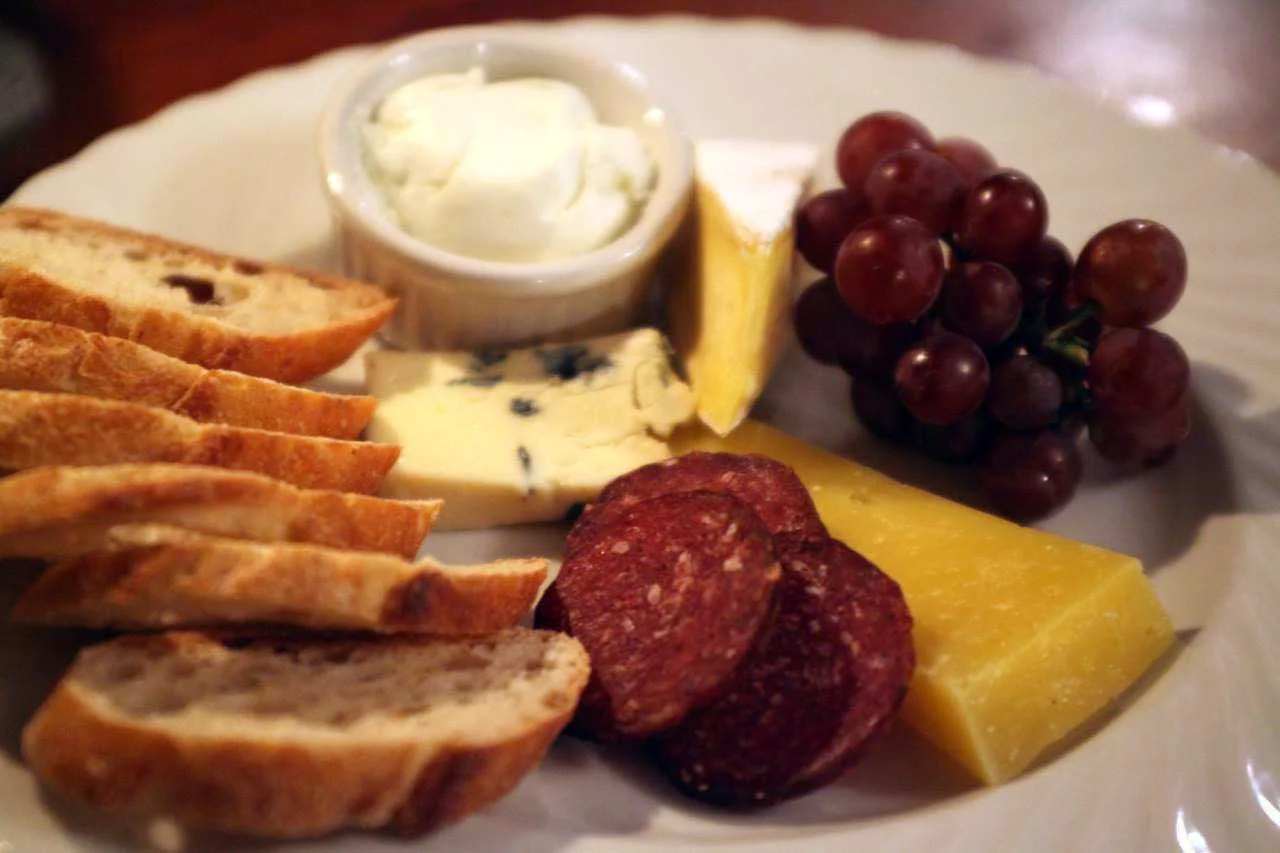 Try our local cheese & charcuterie plate... with Margie from Sprout Creek Farm , Hawthorne Valley Farm Buttercup Run, Rawson Brook Farm garlic & chive chèvre and venison sausage from Highland Farm and Nostrano Vineyards grapes with sourdough baguette from Berkshire Mountain Bakery .