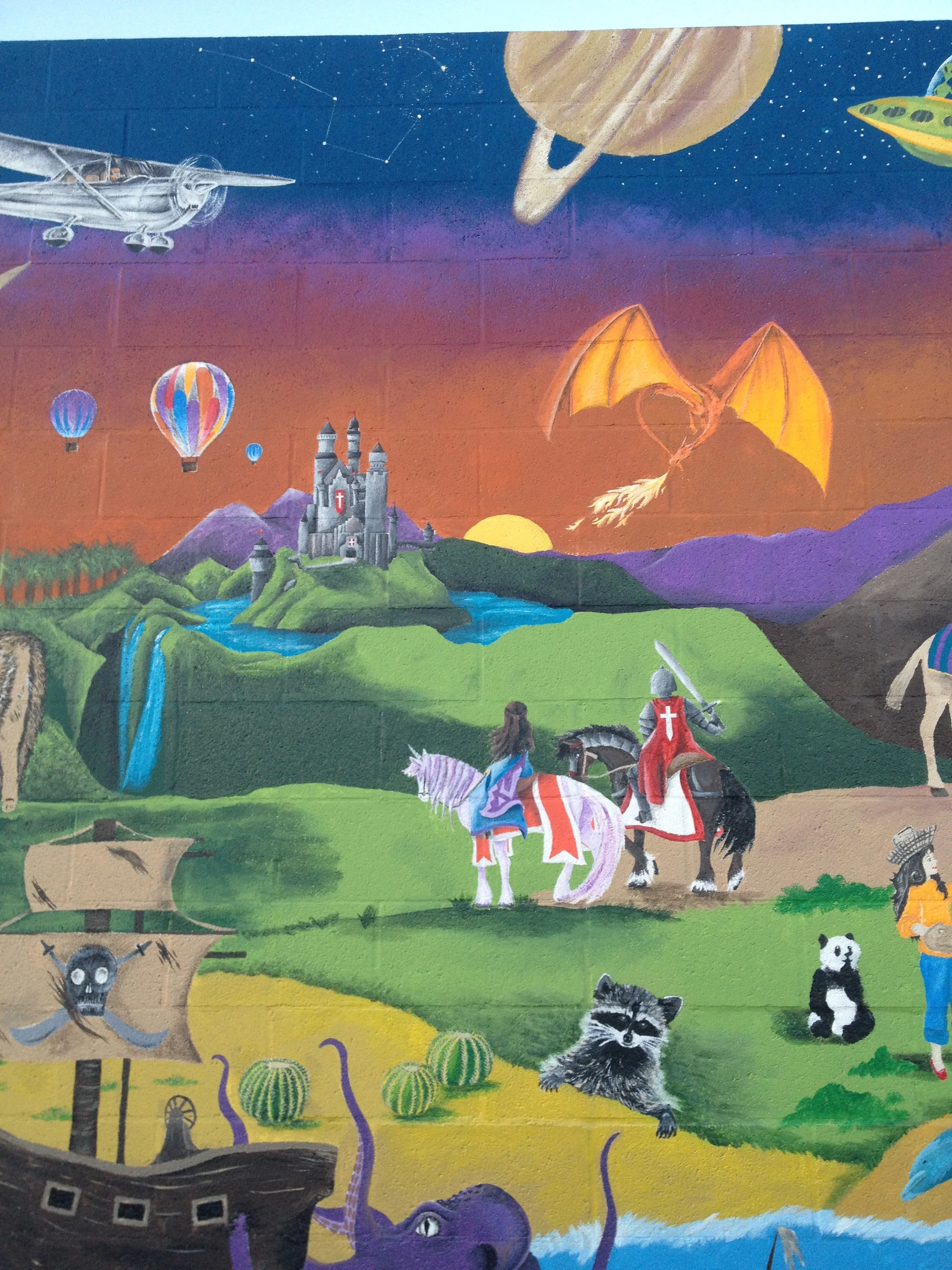 Group mural for elementary school dodgeball wall in Riverside, CA. (Section by artist: medieval castle, knight and princess, and dragon) Finished November 2016
