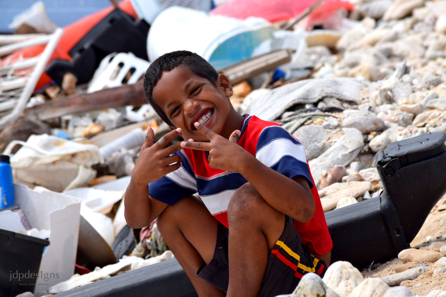 Boy Sledding on Rubble resize.jpg