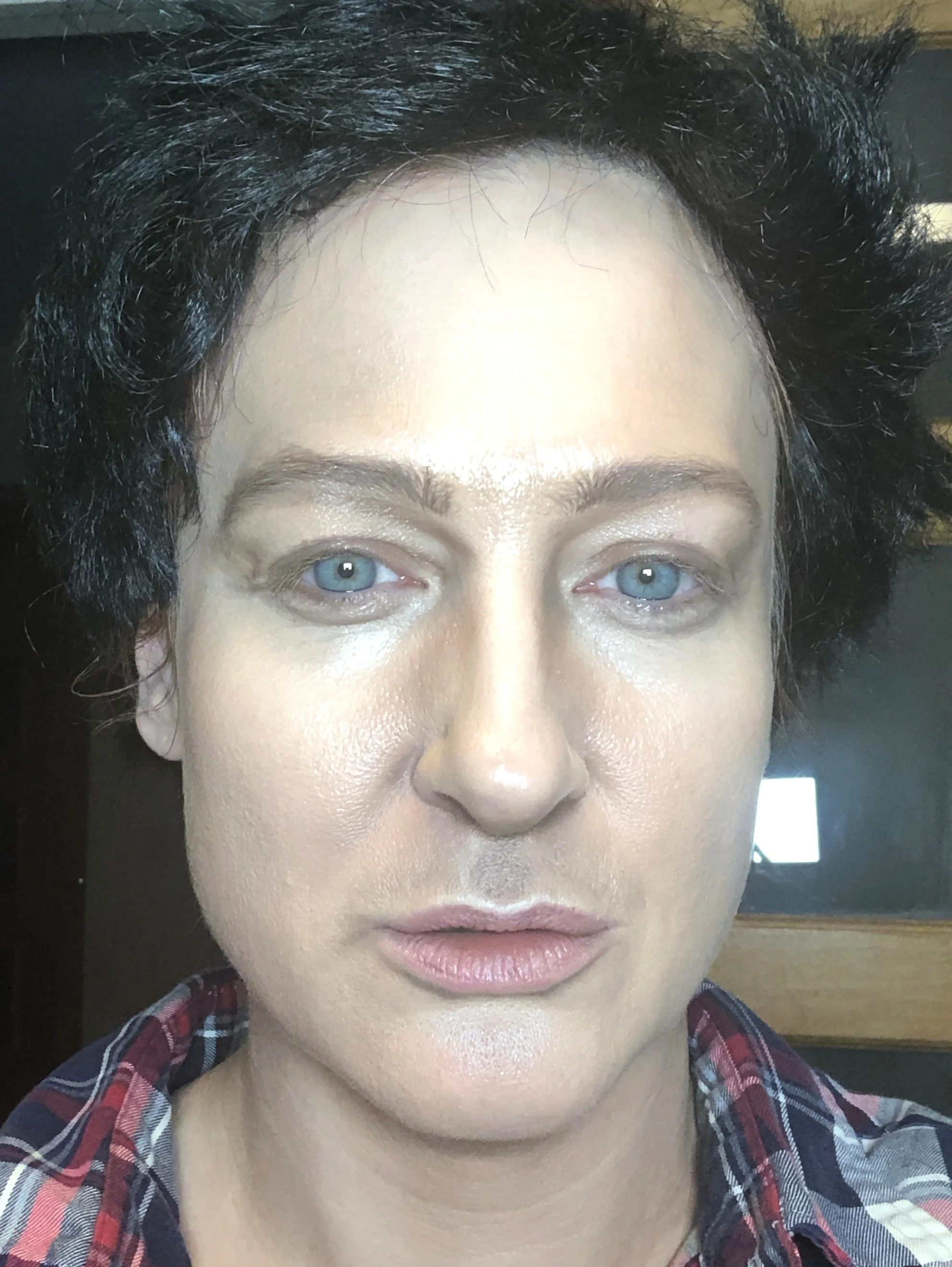 trying the wig on and checking again