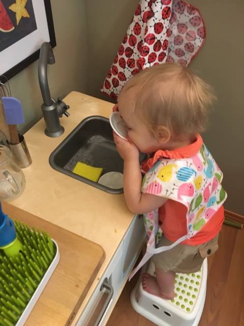 Noora doing dishes.