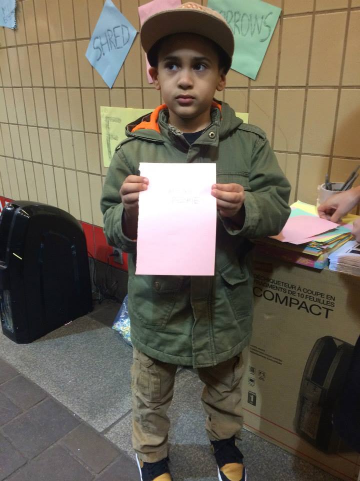  Child holding note 