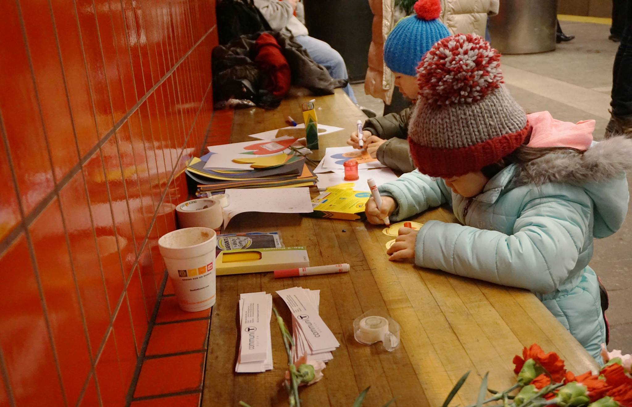  Kids writing notes in subway station 