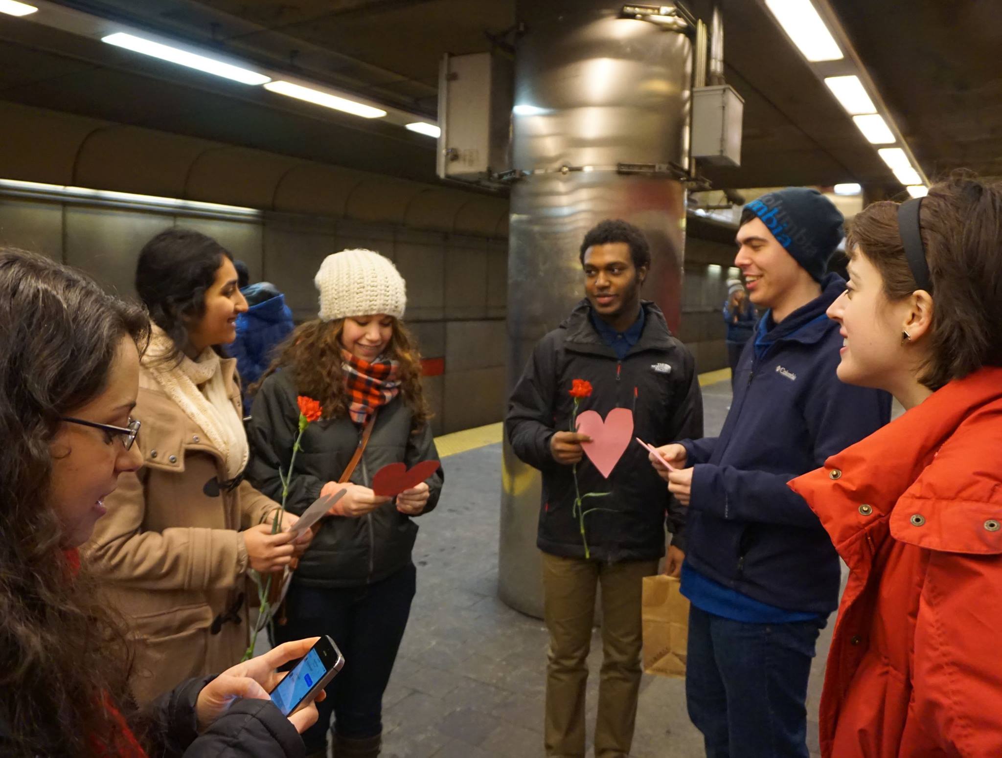  Subway riders gathered with notes and flowers 