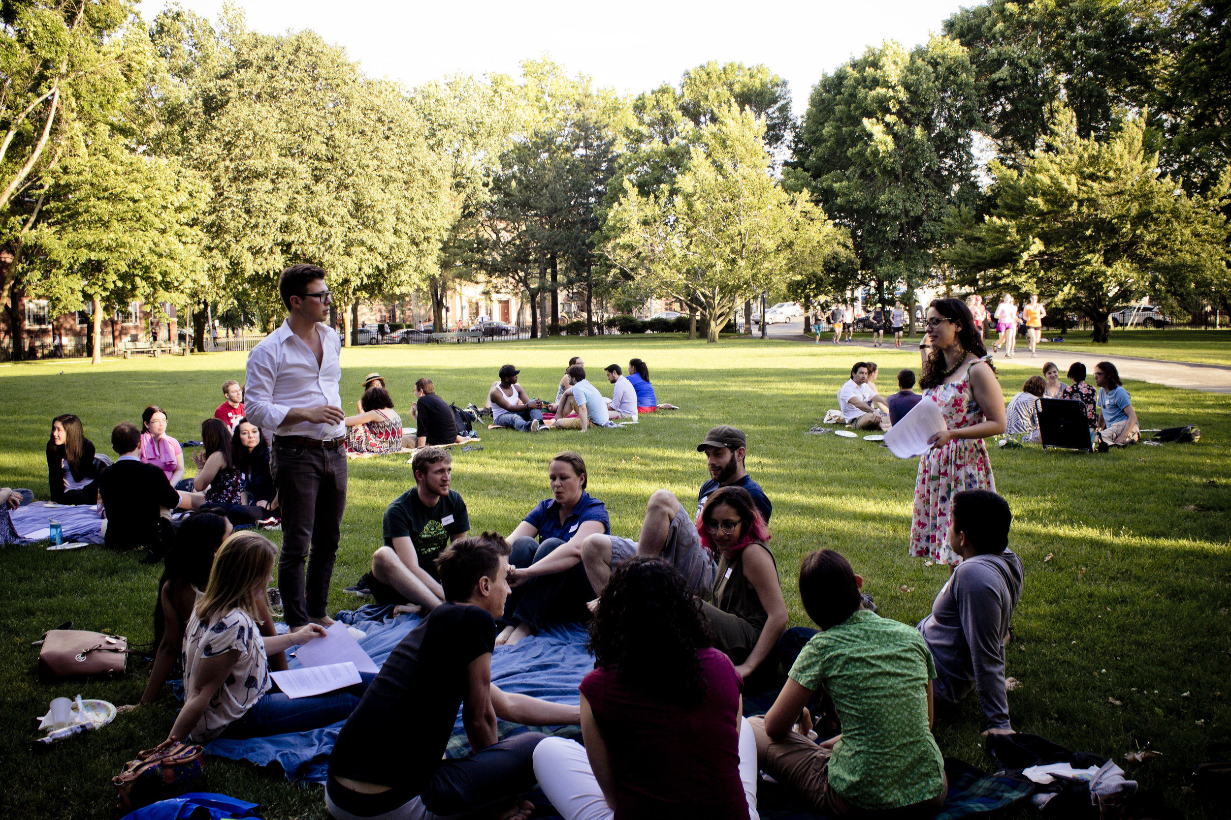  People talking on picnic blankets 