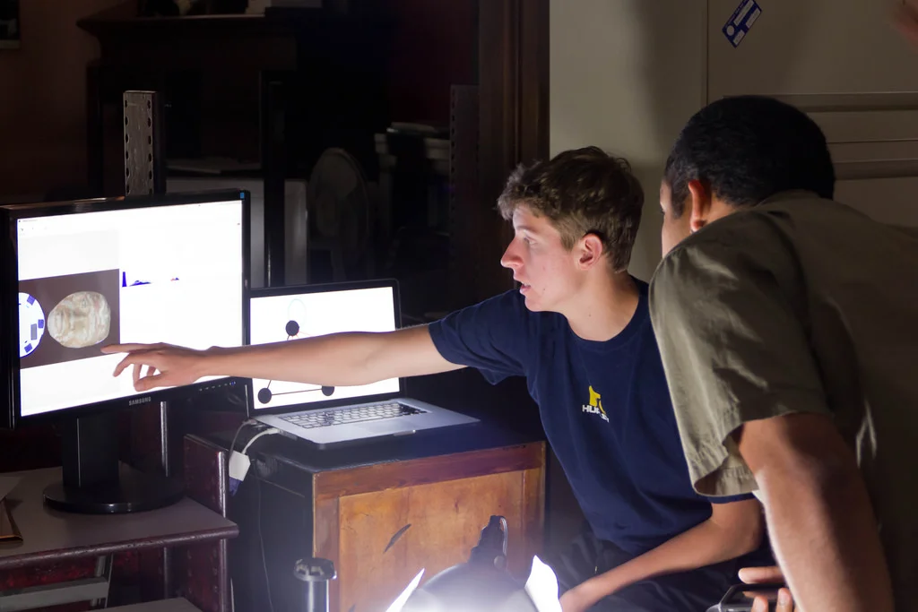 Students previewing artifact images.