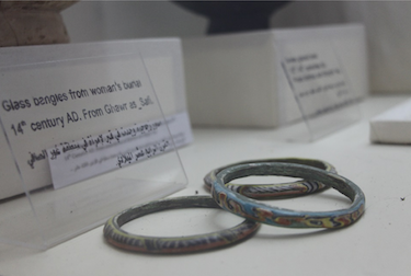 Glass bangles from woman's burial, 14th century AD.