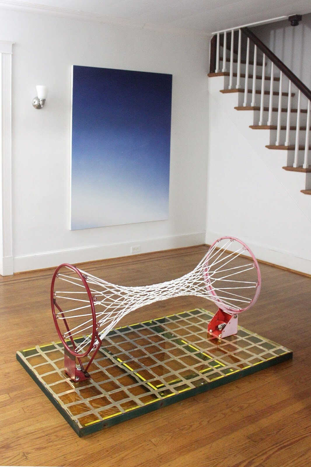  [foreground]  Untitled (Warp) ( Goalrilla backboard frame, steel rims, Color Cast acrylic (yellow transparent #2208), gold leaf, 120 gram all-weather nylon basketball net, various hardware) 2015  [background]  Skywriting (QUIET)  (acrylic on canvas)