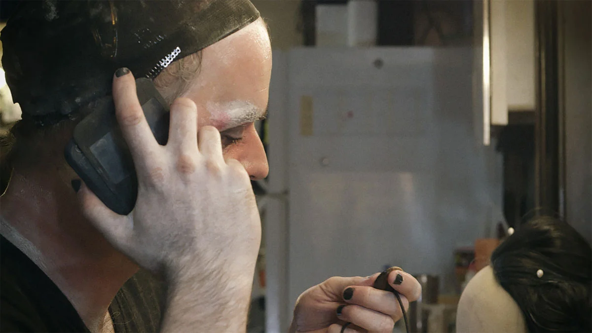 Brendan Dowling as avant-garde legend Peter Fleming, reaching out to ex-leading lady, Kath