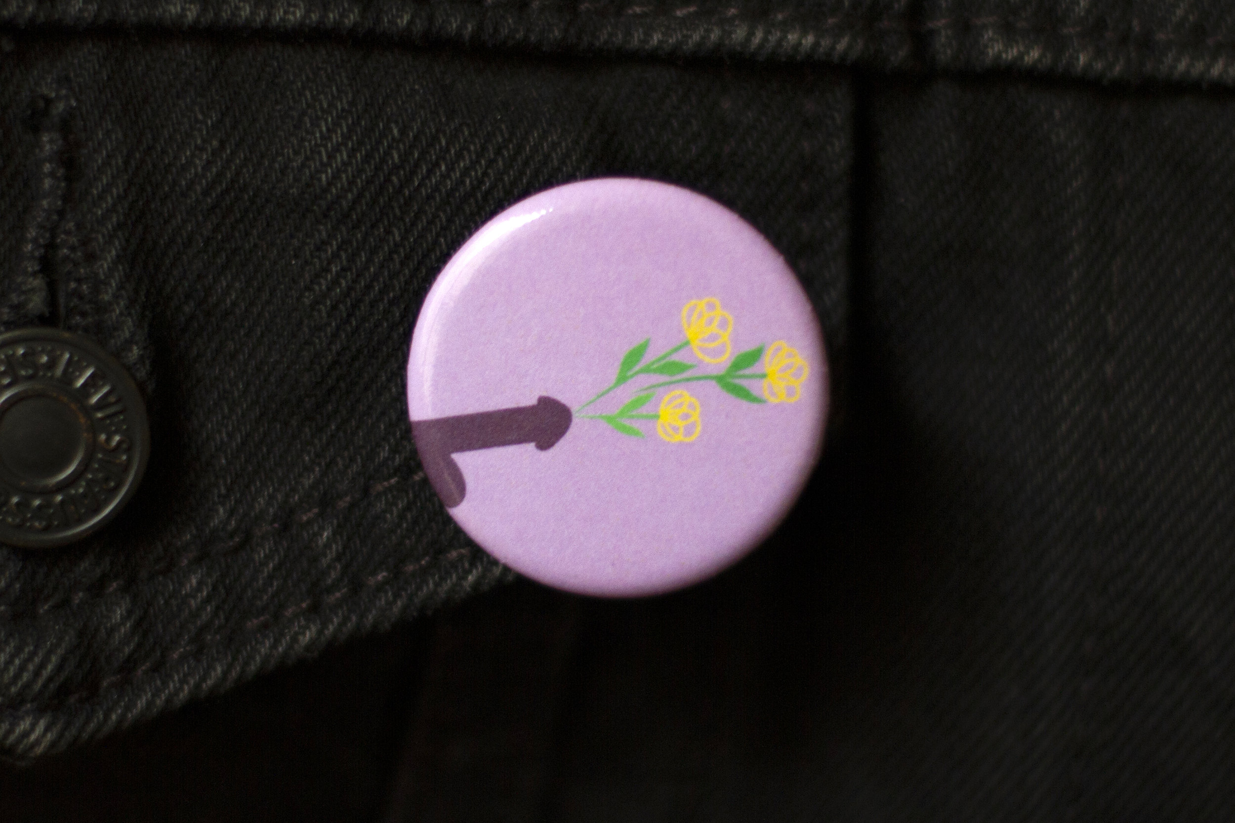 Delicate Flowers art button by CockBloq pinned on a denim jacket