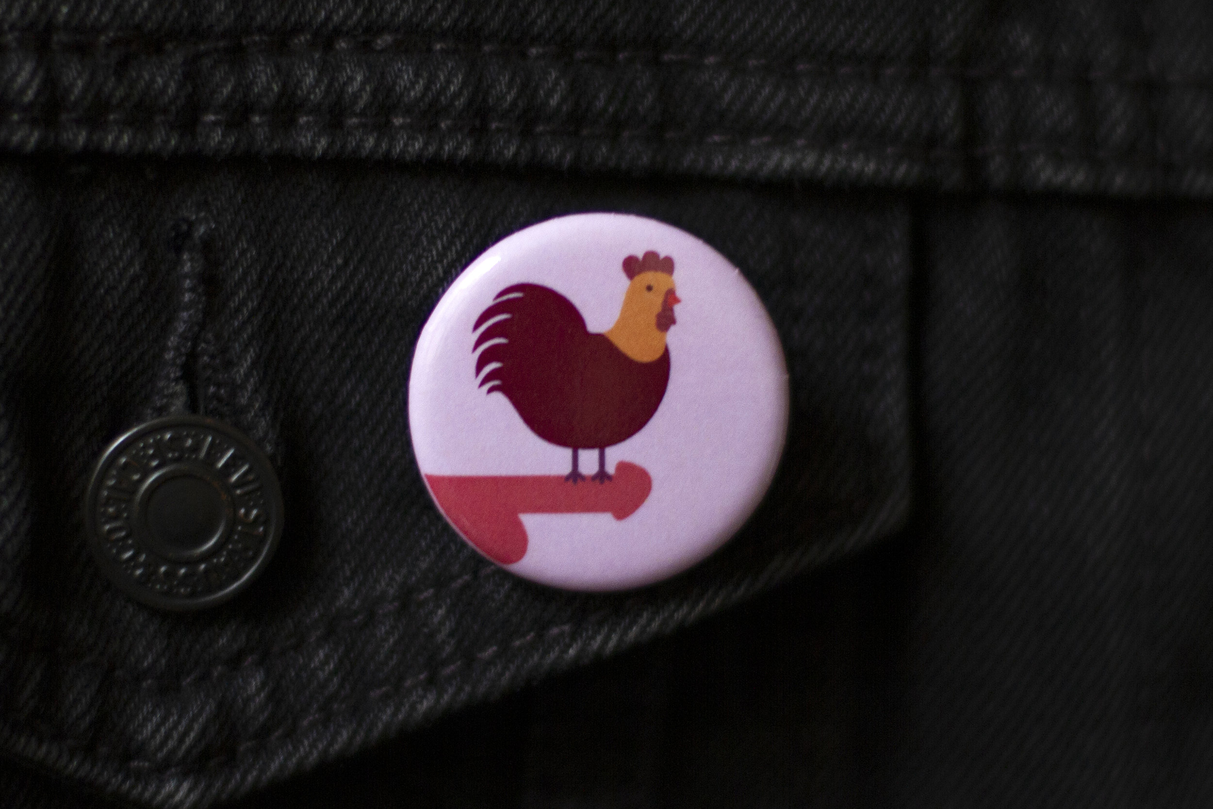 Morning Wood art button by CockBloq pinned on a denim jacket