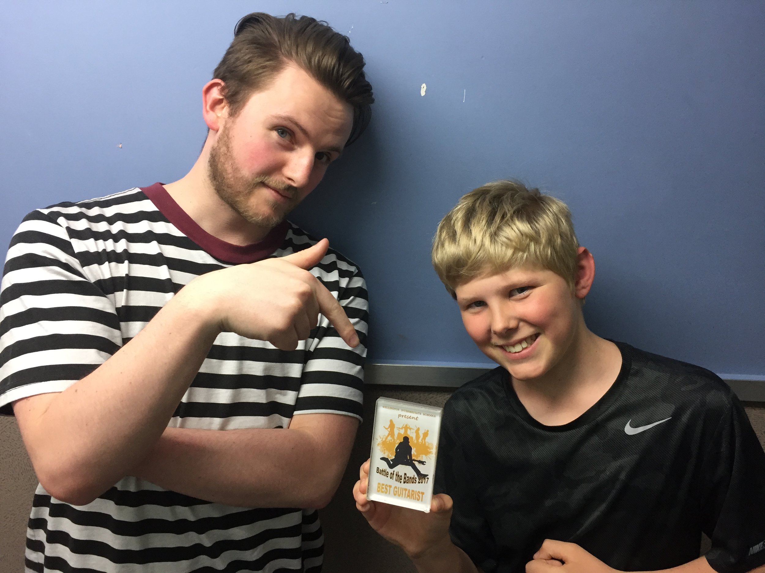 Guitar teacher and student with ‘Best Guitarist’ prize