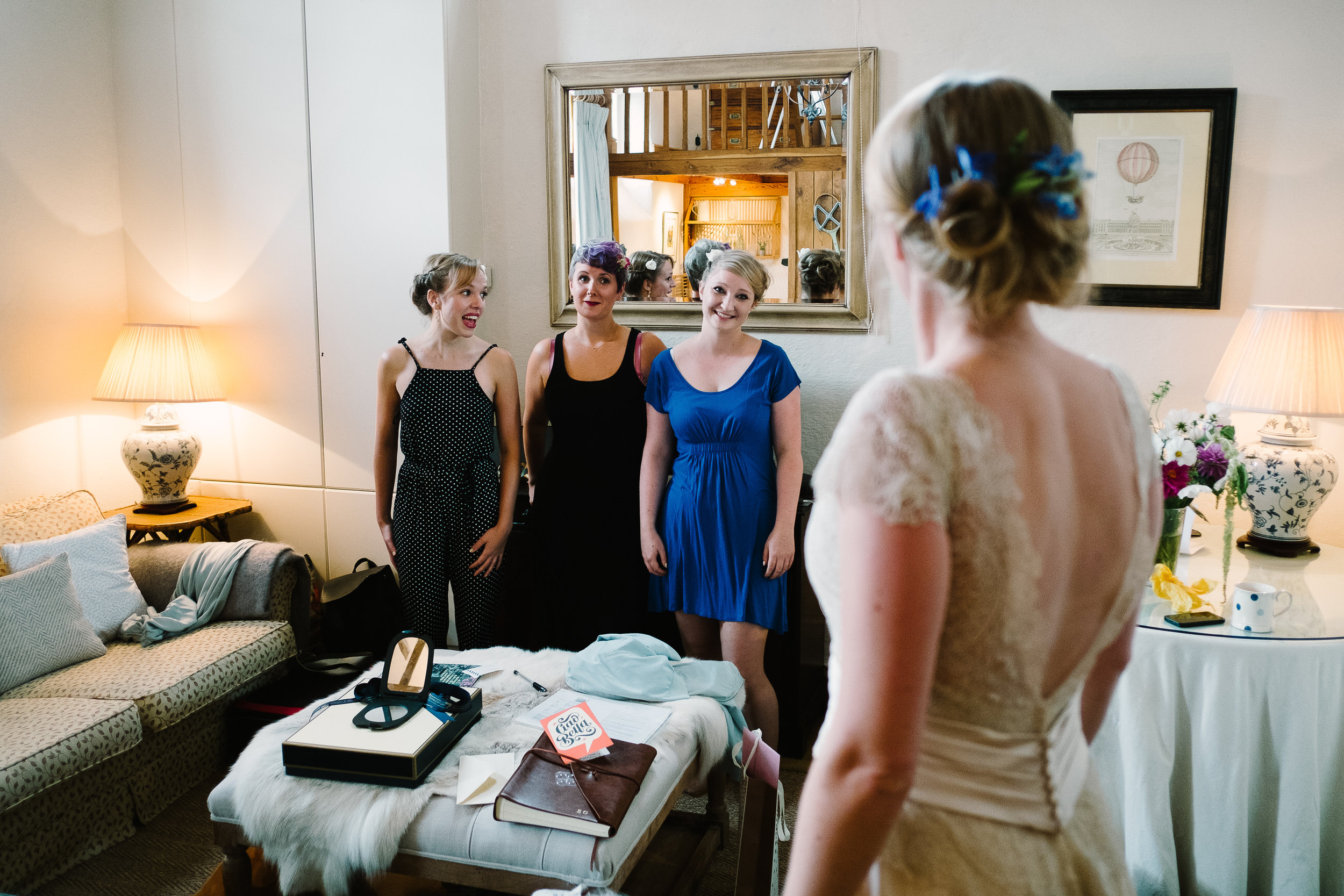 Bridesmaids admiring a bride at Merriscourt Wedding Venue, Oxfordshire