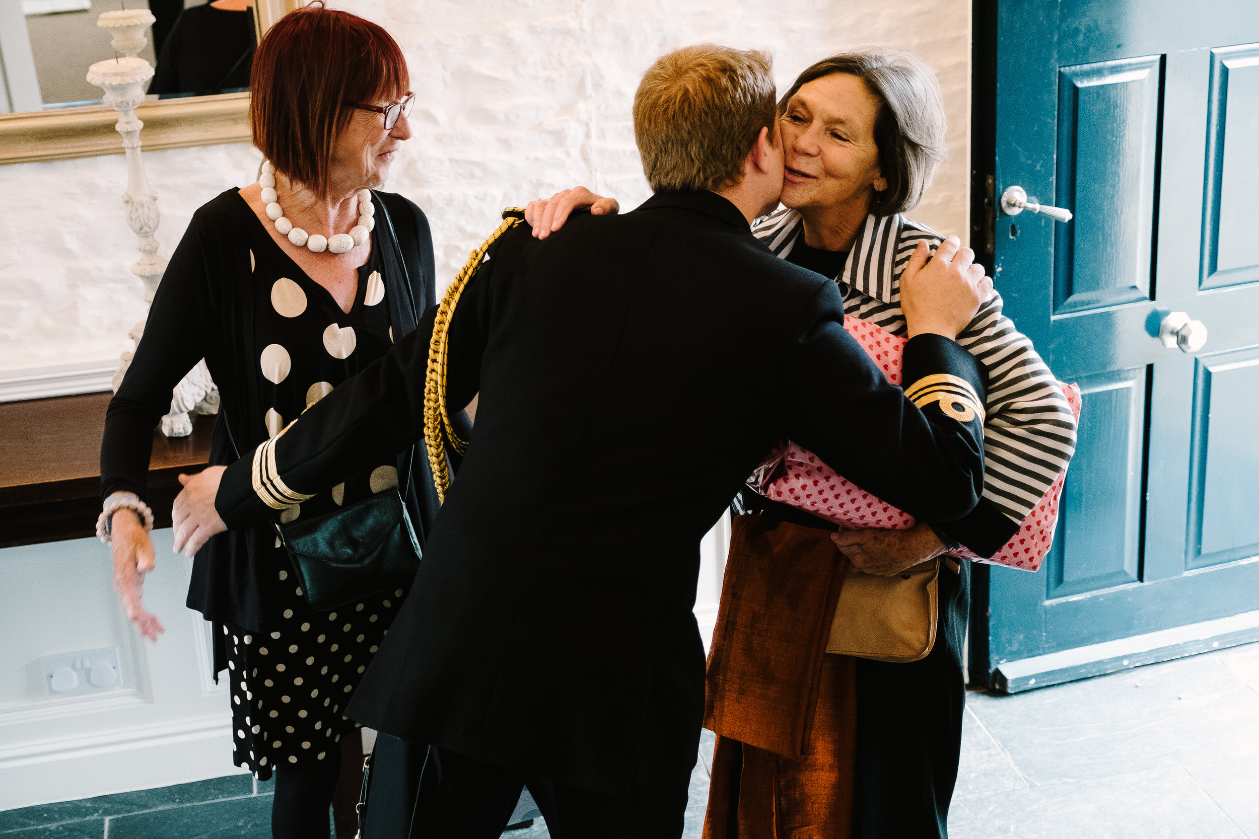 A groom greeting guests at Merriscourt Wedding Venue, Oxfordshire