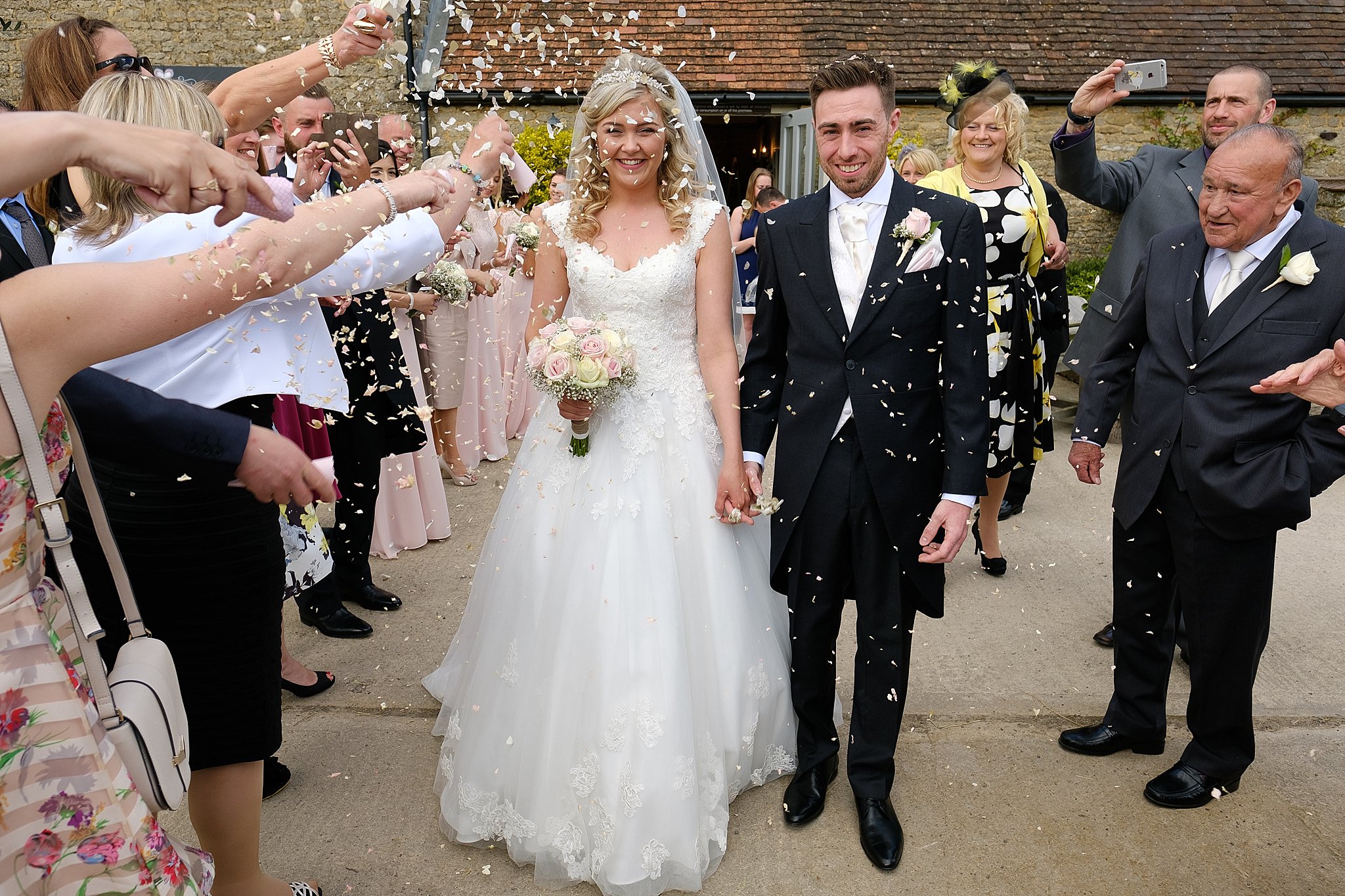 The bride and groom Jemma and David outside their wedding venue, Stratton Court Barn , Bicester