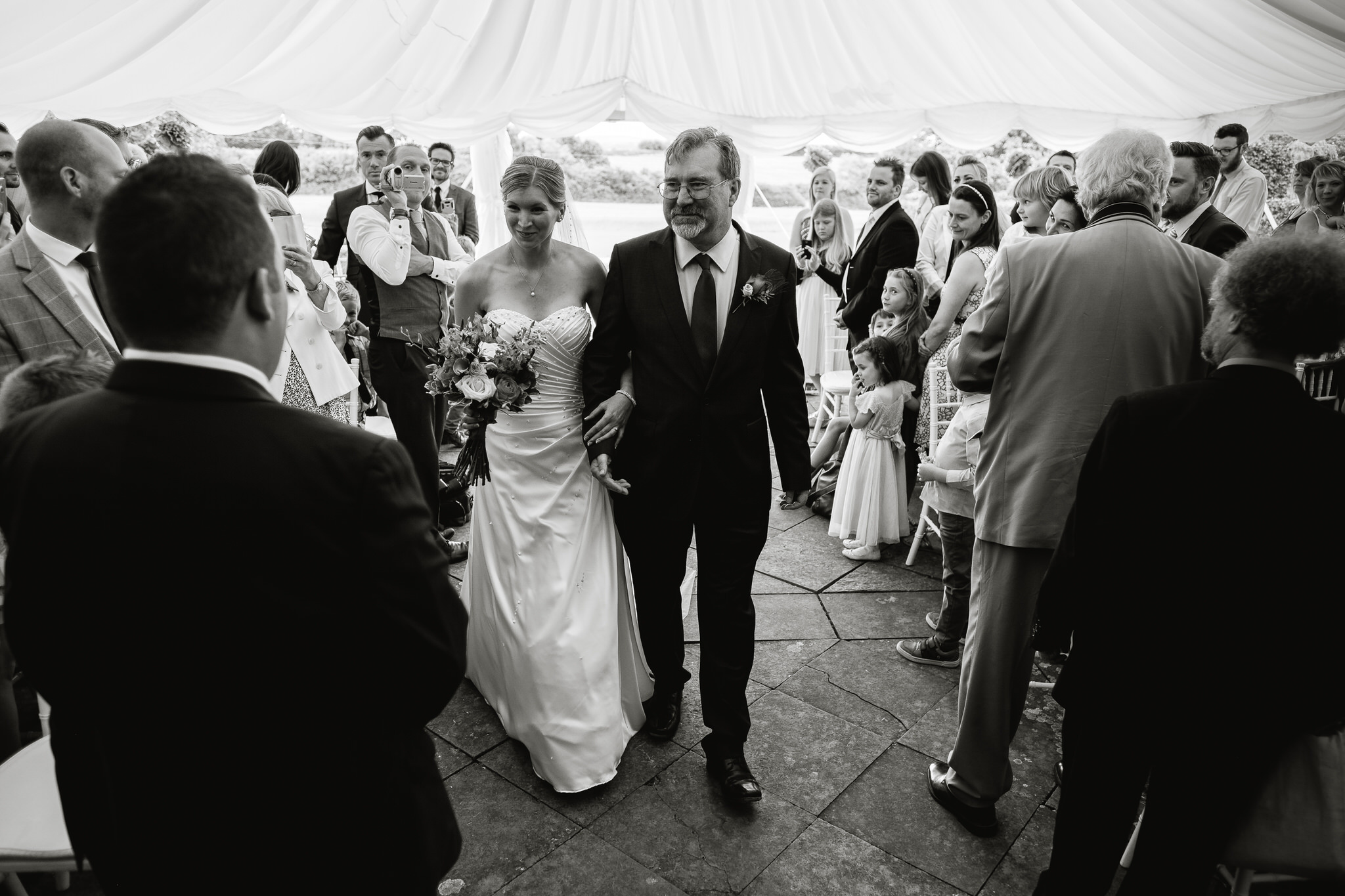 A groom sees his bride at a wedding at Poundon House, Near Bicester Oxfordshire