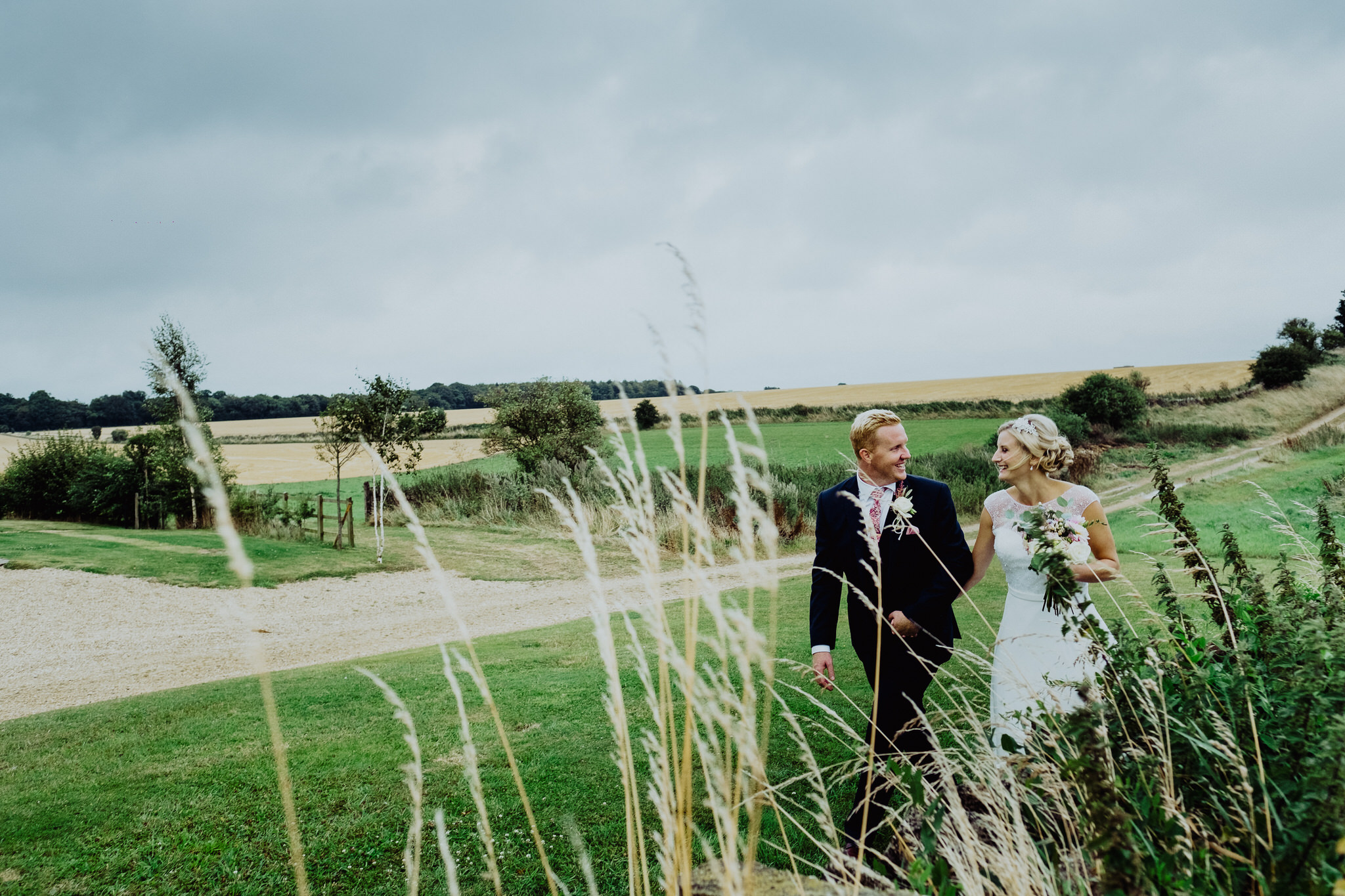 A bride and groom at a wedding at Cripps Stone Barn, Cheltenham, Gloucestershire. 