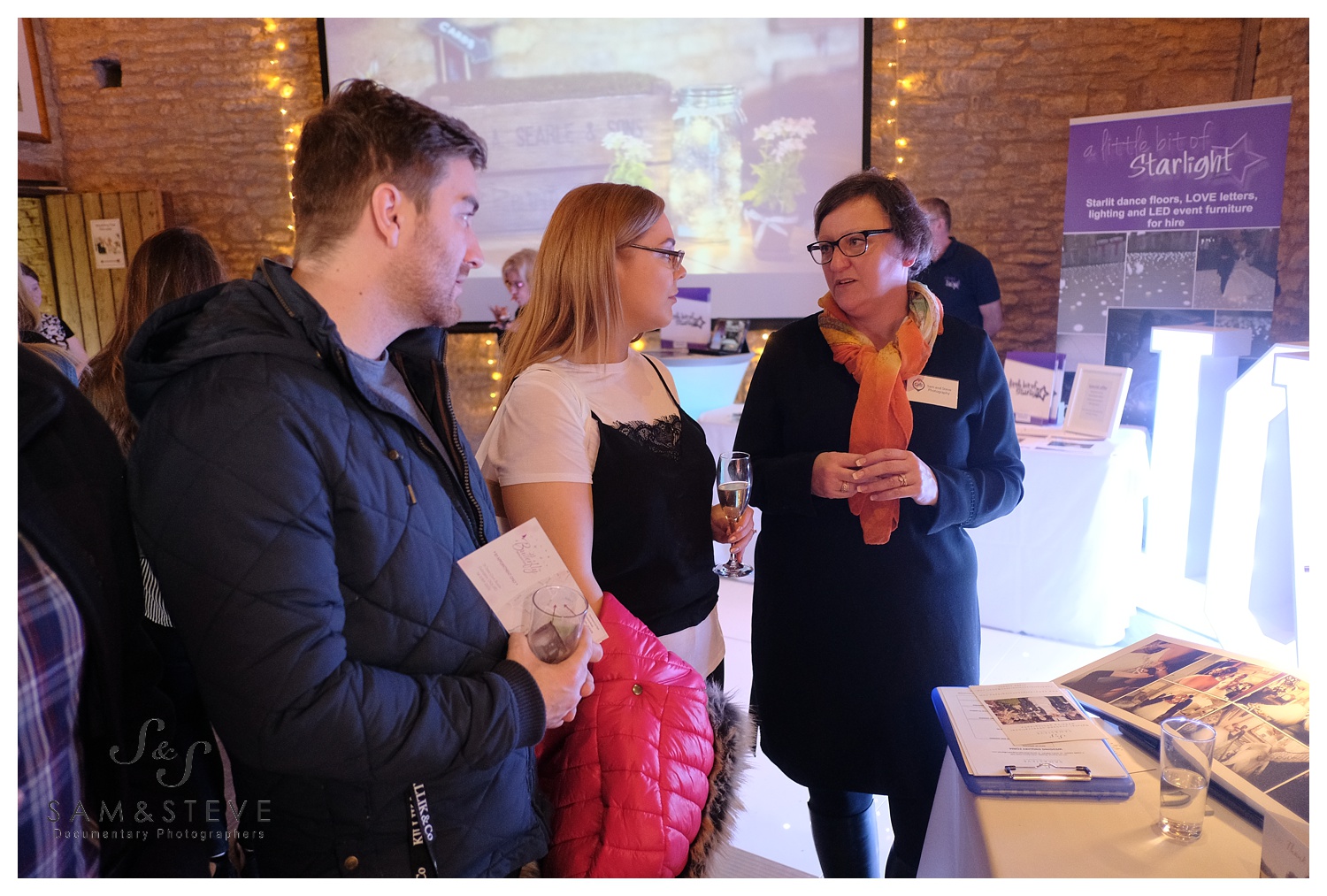 Sam chatting with a couple at the Tythe Barn wedding fair