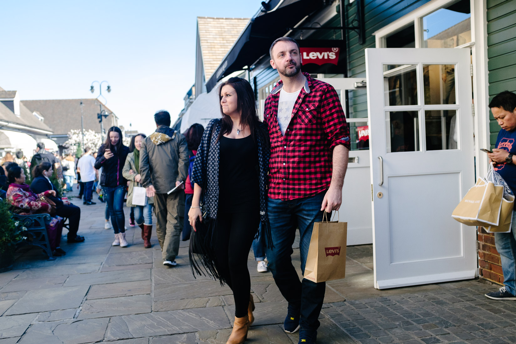 Shoppers outside the Levi store at Bicester Village Outlet centre