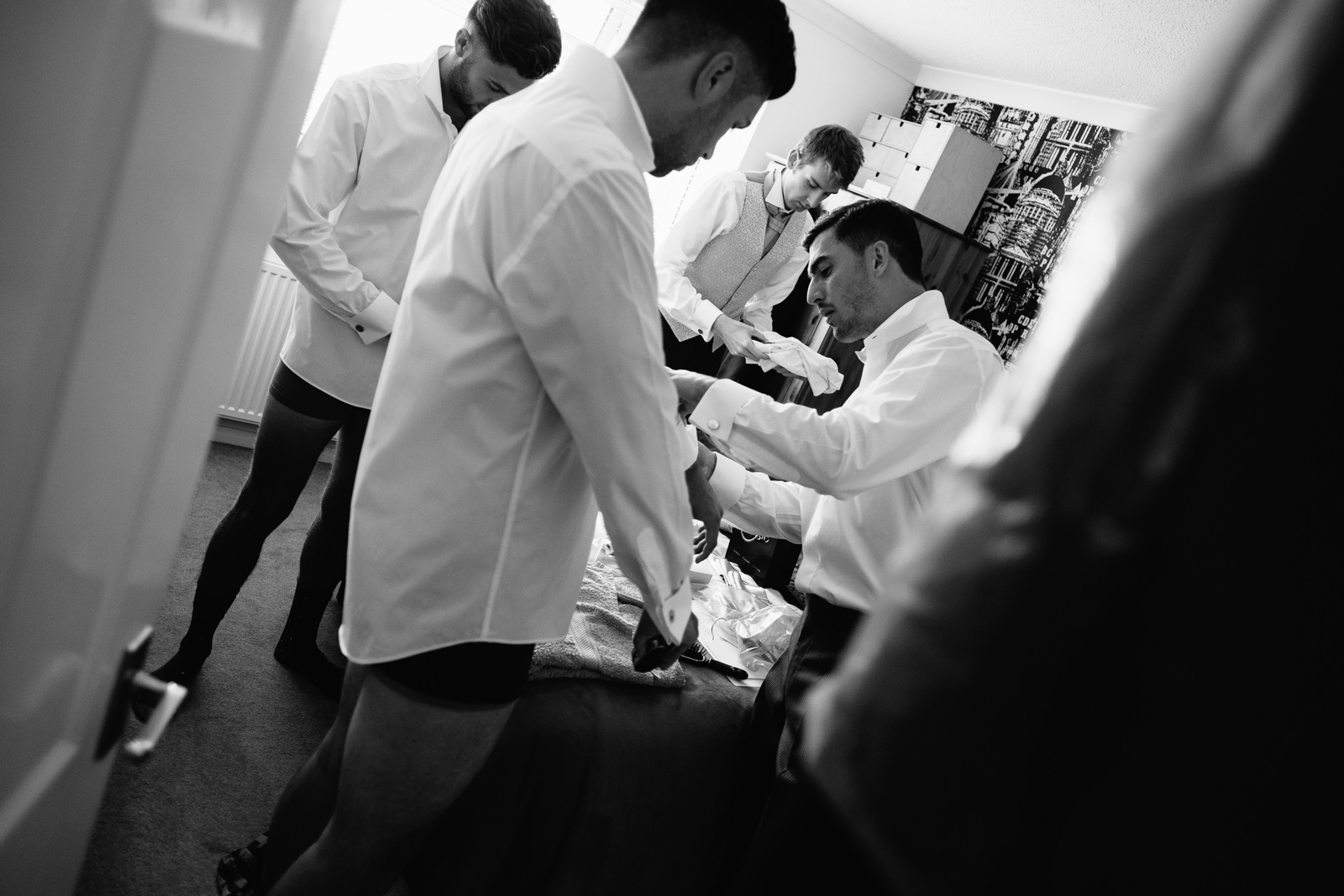 Bridegroom getting ready before his wedding. Photo by Sam and Steve Photography