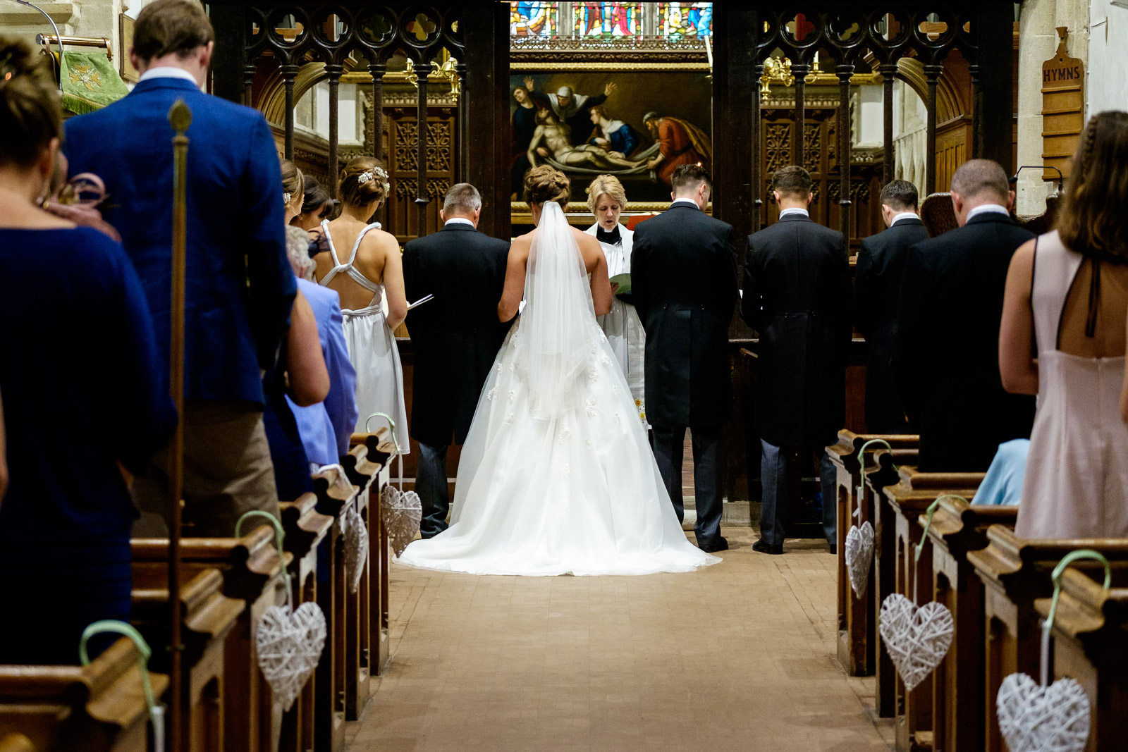A vicar conducts a wedding at Chinnor Church. Photo by Sam and Steve Photography. 