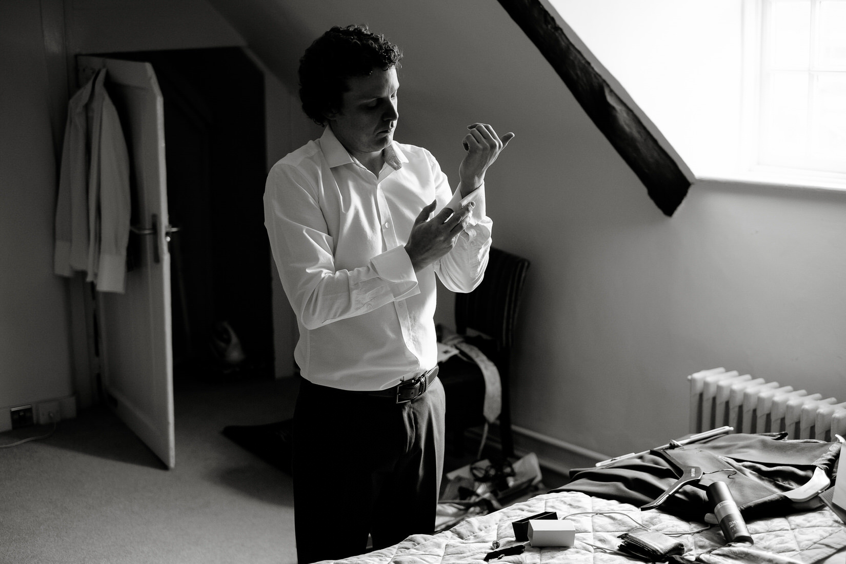 A groom getting ready before his wedding in Bicester. Photography by Sam and Steve Photography