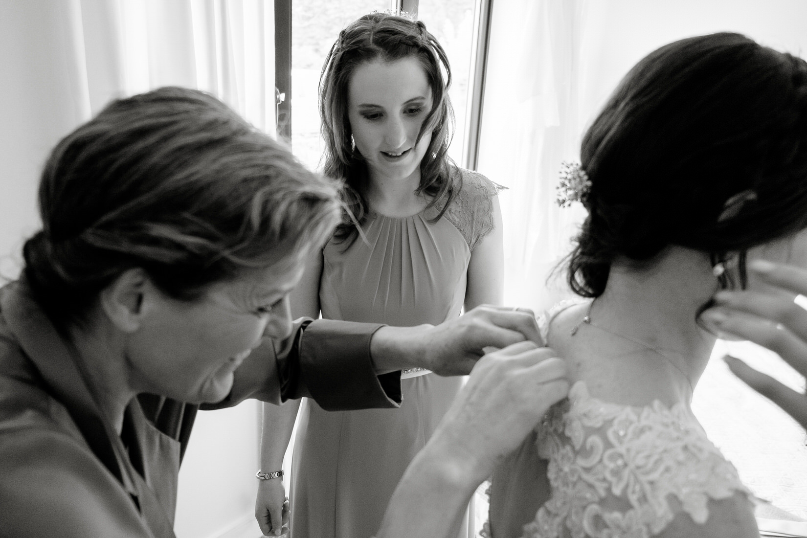 A bride getting ready before her wedding at the Great Barn, Aynho. By Sam and Steve Photography