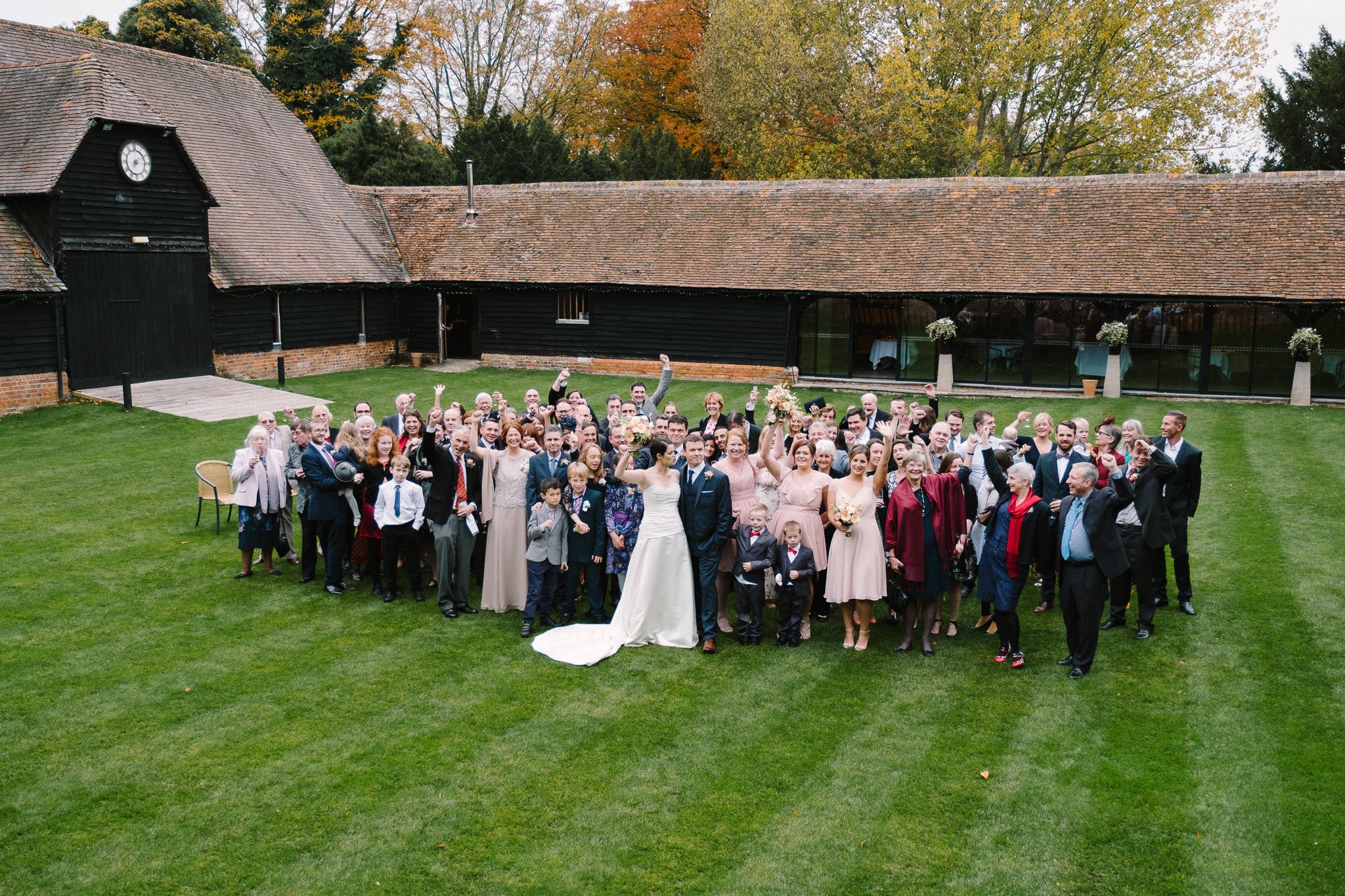 Wedding guests on the lawn at Lains Barn Wedding Venue Oxfordshire