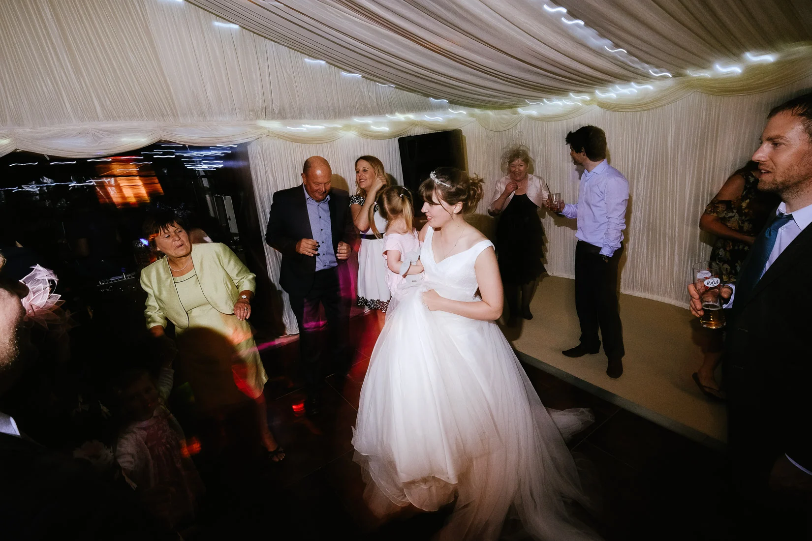 Wedding guests partying at a wedding in Mixbury, Oxfordshire