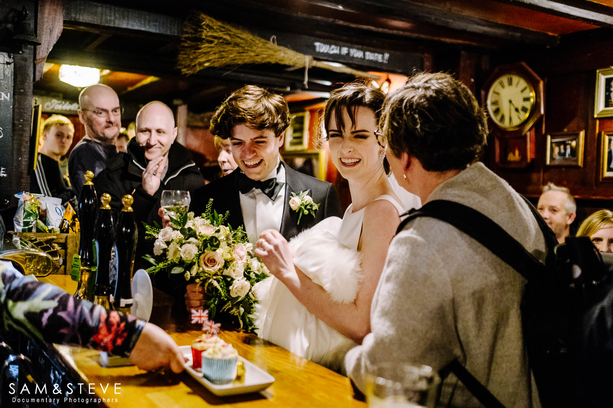 Daisy and Adam enjoying a pint, whilst Sam and a cake, whilst Sam ask congratulates them!