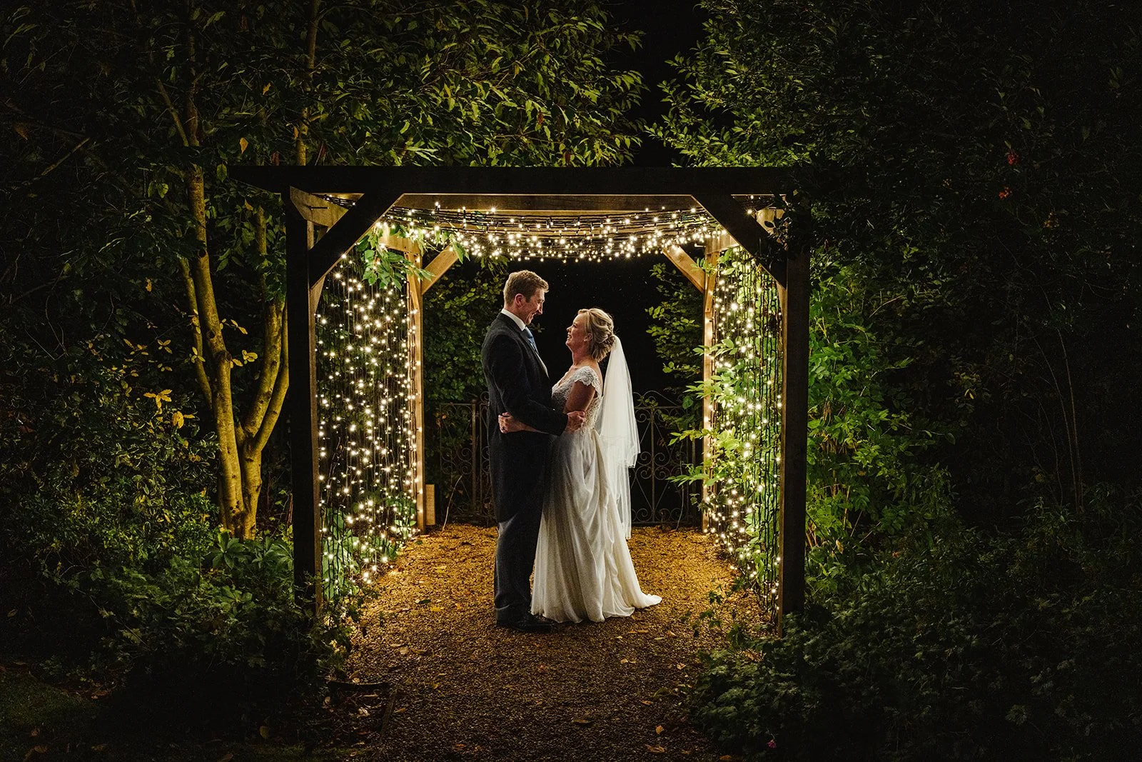 A bride and Groom at night at Caswell House
