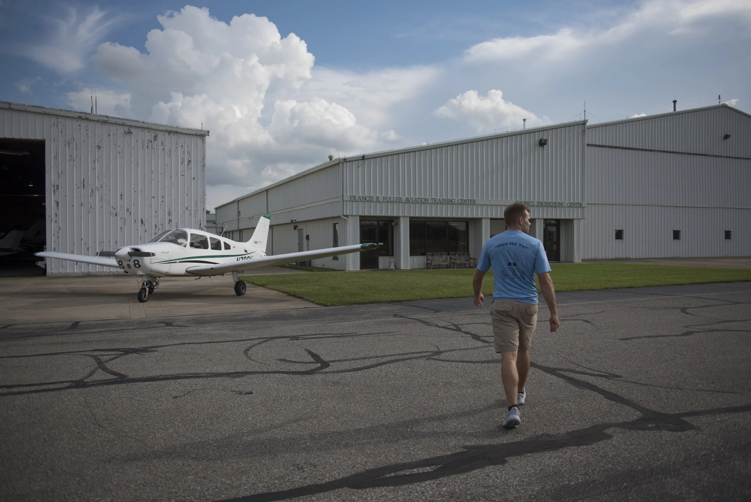 Ohio University senior Ryan Potter, a member of ROTC Air Force, walks back to the training center at Gordon K. Bush Airport on Sept. 20, 2017 after completing his preflight checks.