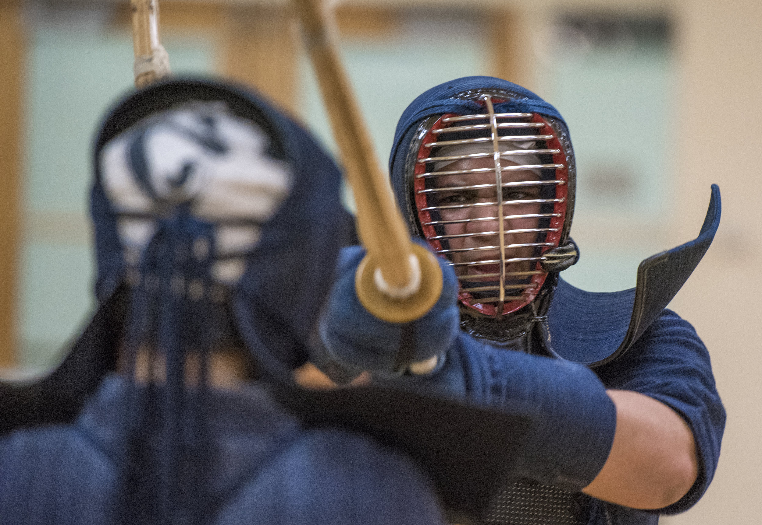  Alex Airado, a senior studying criminology, practices kendo moves against another member of the Ohio University kendo club.&nbsp; 