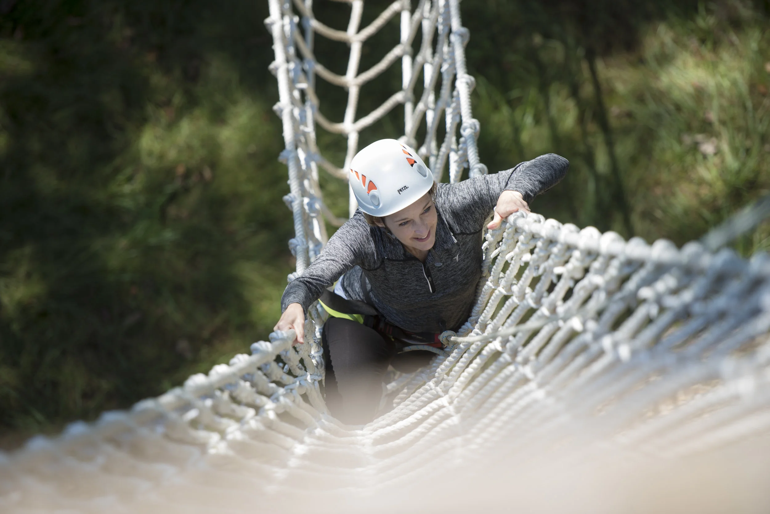  Pamela Gaboury climbs up the ziplining tower at the Challenge Course on Oct. 2, 2018 at The Ridges in Athens, Ohio. 