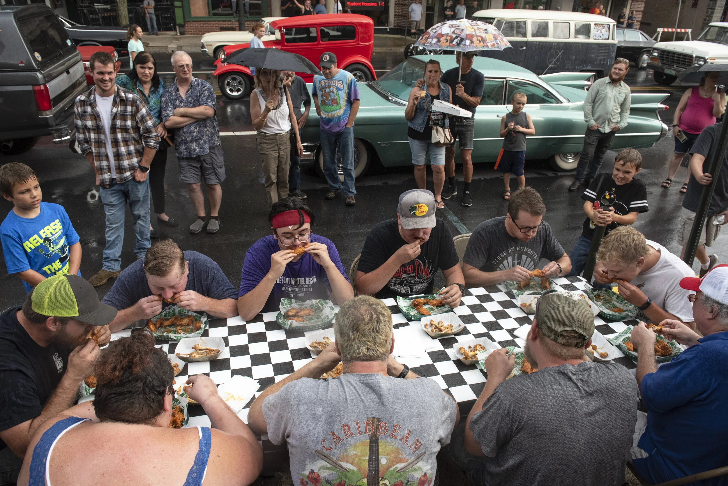  Contestants participate in a wing eating contest during Gridlock August 8, 2019 on Main Street in Bloomsburg, Pennsylvania.  
